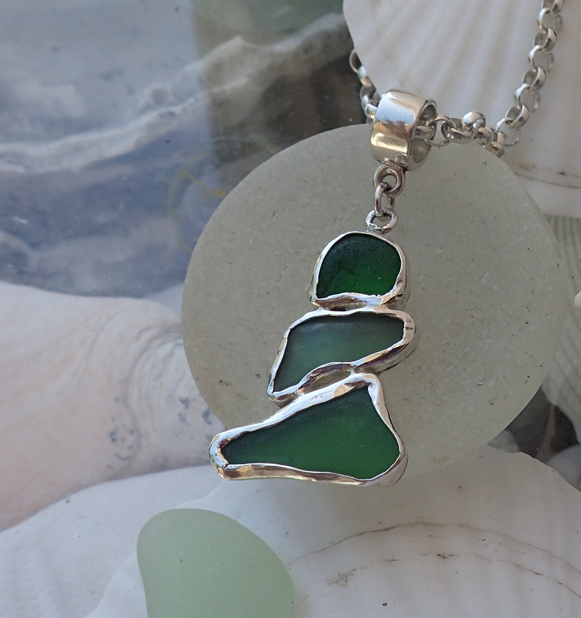 Three pieces of green authentic seaglass snuggle into a showstopping pendant